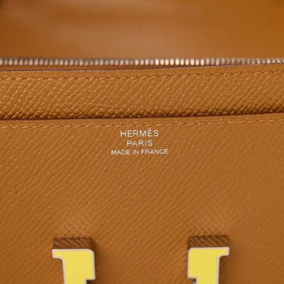 HERMES Epsom Enamel Constance Wallet To Go Sesame Lime