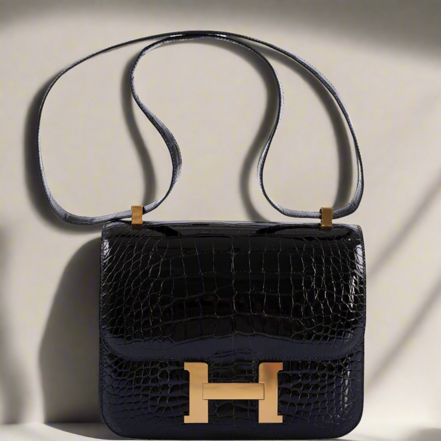 Hermès Constance 24 Verso Shiny Black Alligator and Rouge H with Gold Hardware